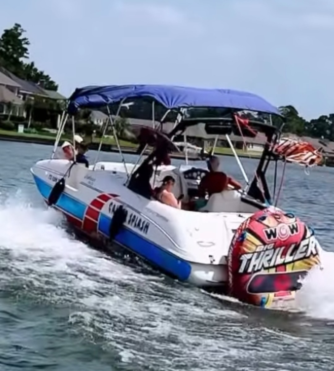 The Nauti Explorer towing the tube